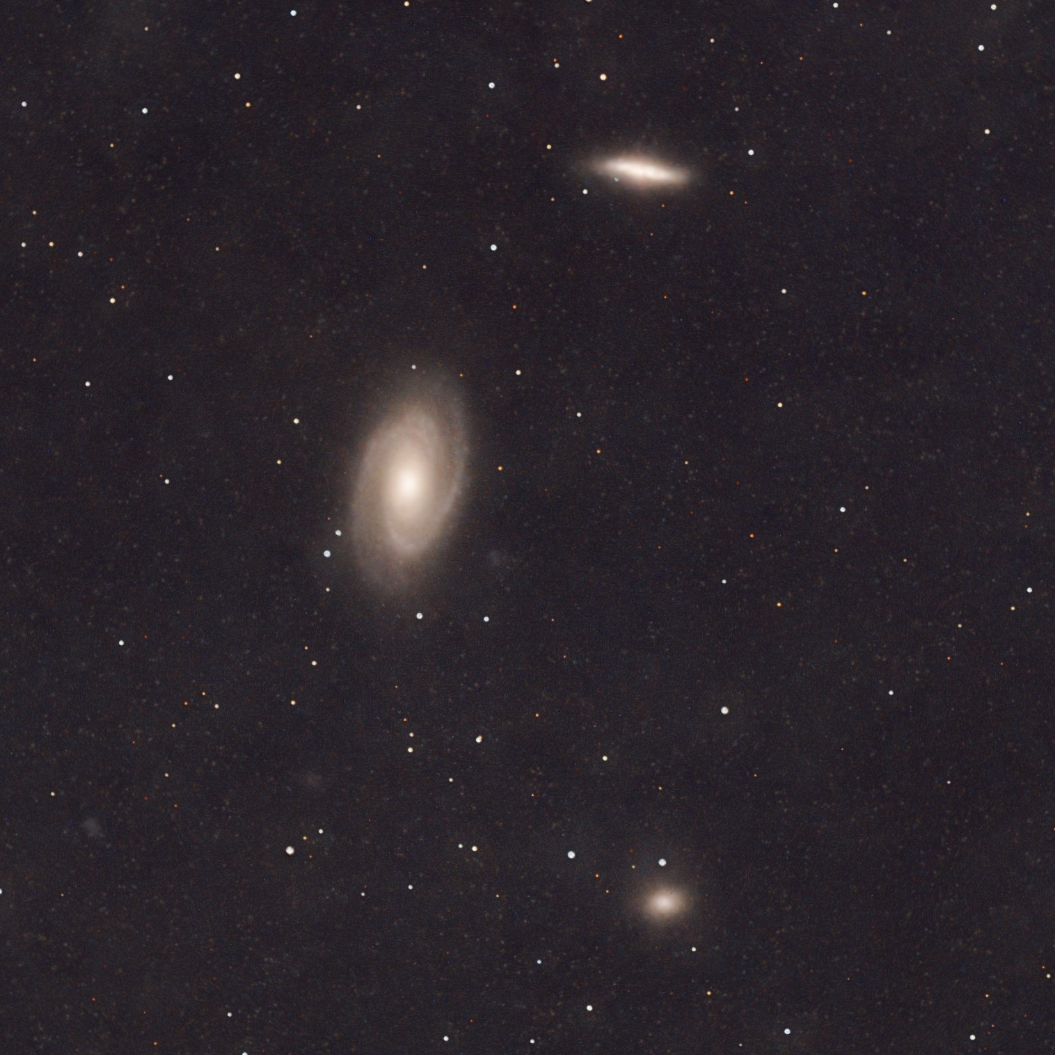Bode's Galaxy (M81, centre), the Cigar Galaxy (M82, top-right), and the NGC 3077 elliptical galaxy (lower-right).