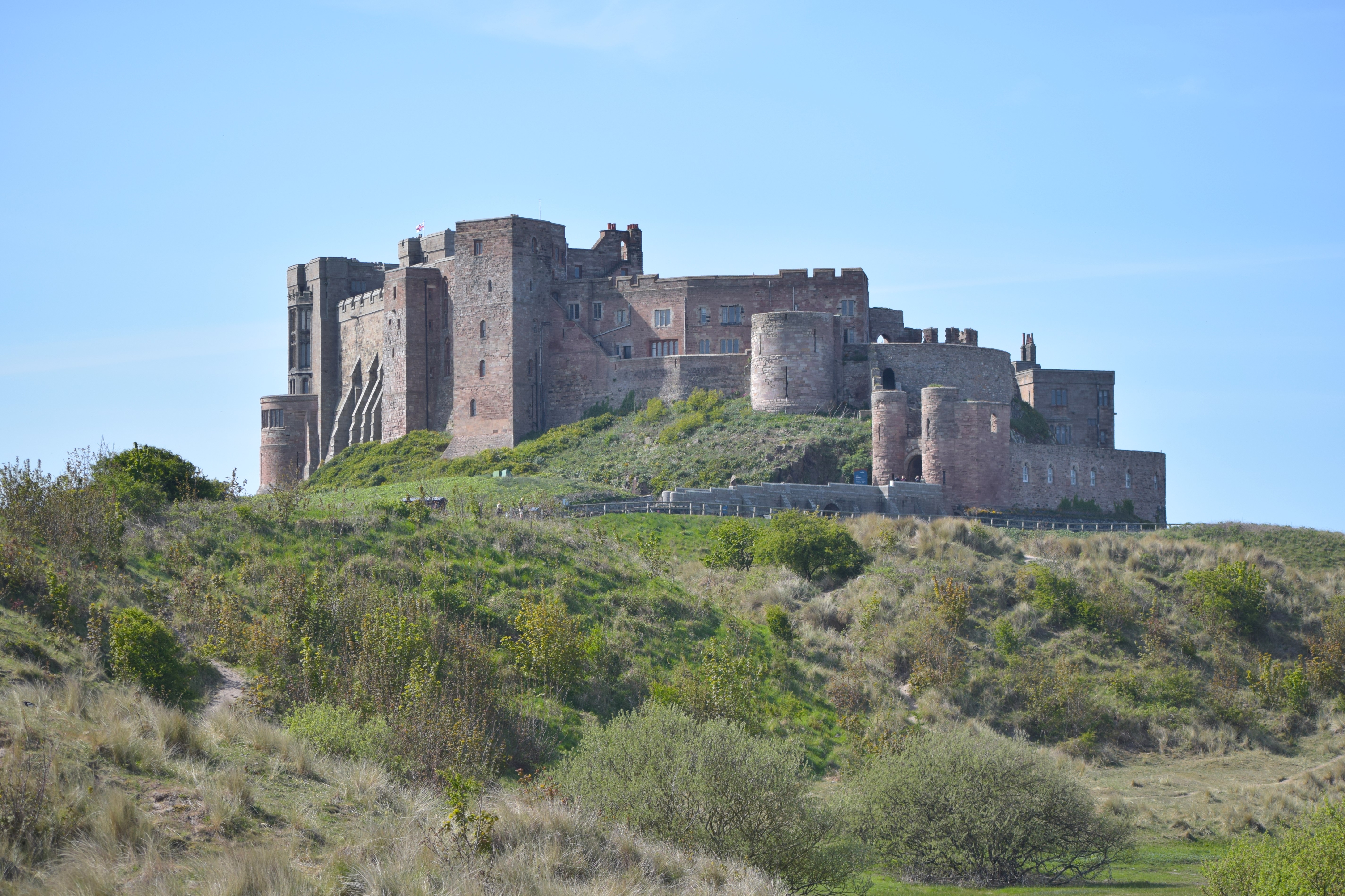 Bamburgh Castle, over the hills and dunes of the Northumbrian coast